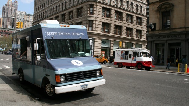 On Fifth Avenue, two trucks work side by side. Kelvin (left) sells specialty slushies while on the opposite side of the street, crepes can be found in a custom-made truck.